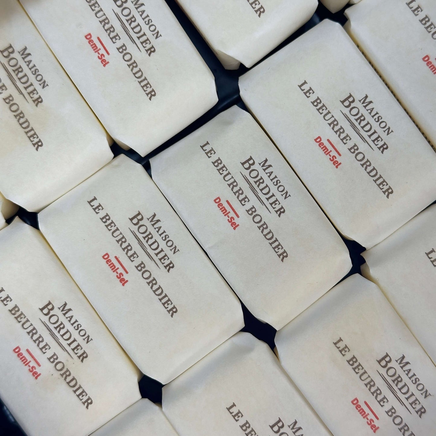 Le Beurre Bordier Mini Salted Butter "Demi-Sel" packaged in traditional paper wrappers.