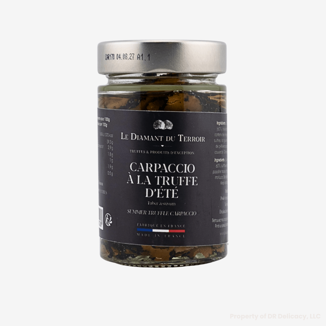 Jar of Summer Truffle Carpaccio, featuring thin slices of Tuber aestivum truffles for gourmet dishes.