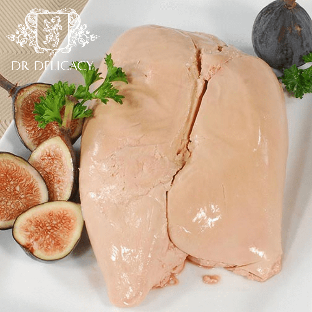 Superfrozen Deveined Duck Foie Gras served with fresh figs and parsley on a white plate.
