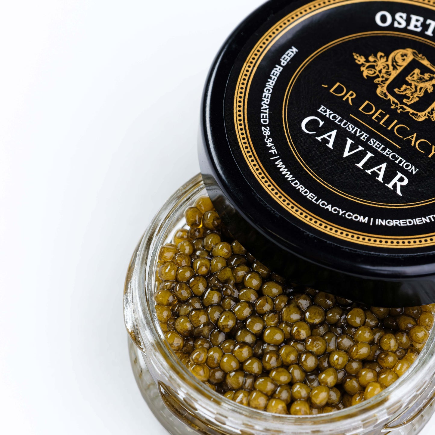 Jar of Osetra Imperial Gold Caviar with golden pearls, presented by DR Delicacy, featuring a sleek black lid.