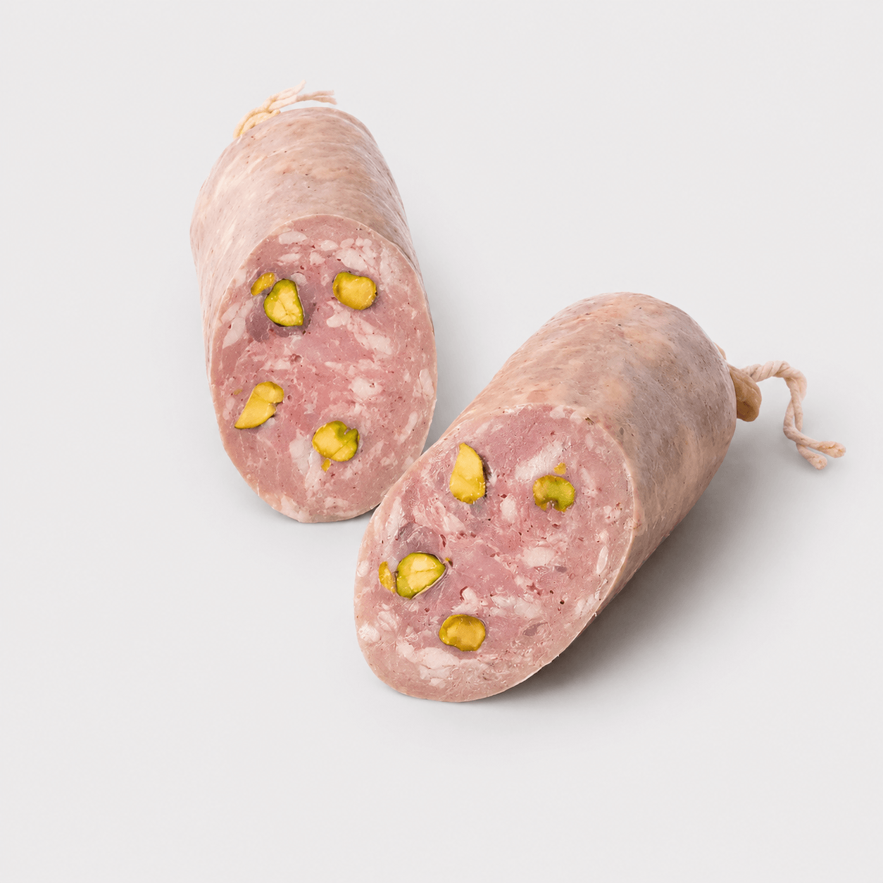 Dufour Saucisson de Lyon with Pistachios, showcasing coarsely ground pork and whole pistachios, ideal for charcuterie boards.