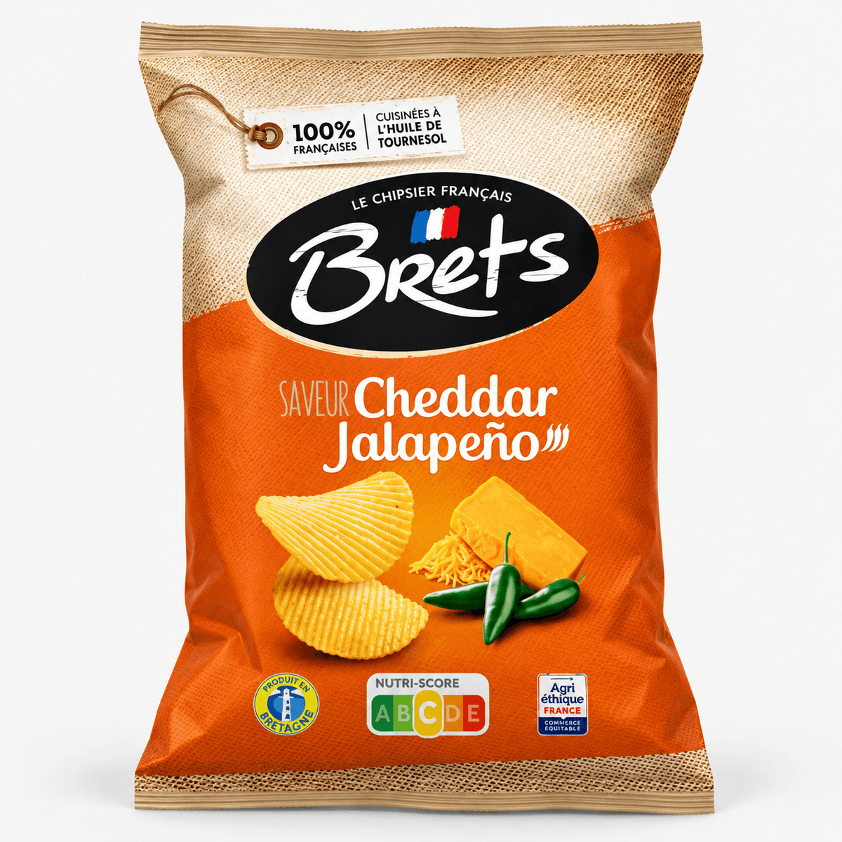 Brets Cheddar & Jalapeño Potato Chips bag featuring cheddar cheese and jalapeño peppers on an orange background.