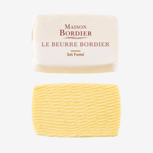 Le Beurre Bordier Smoked Salt Butter in a gourmet packaging, showcasing its rich texture and smoked flavor.