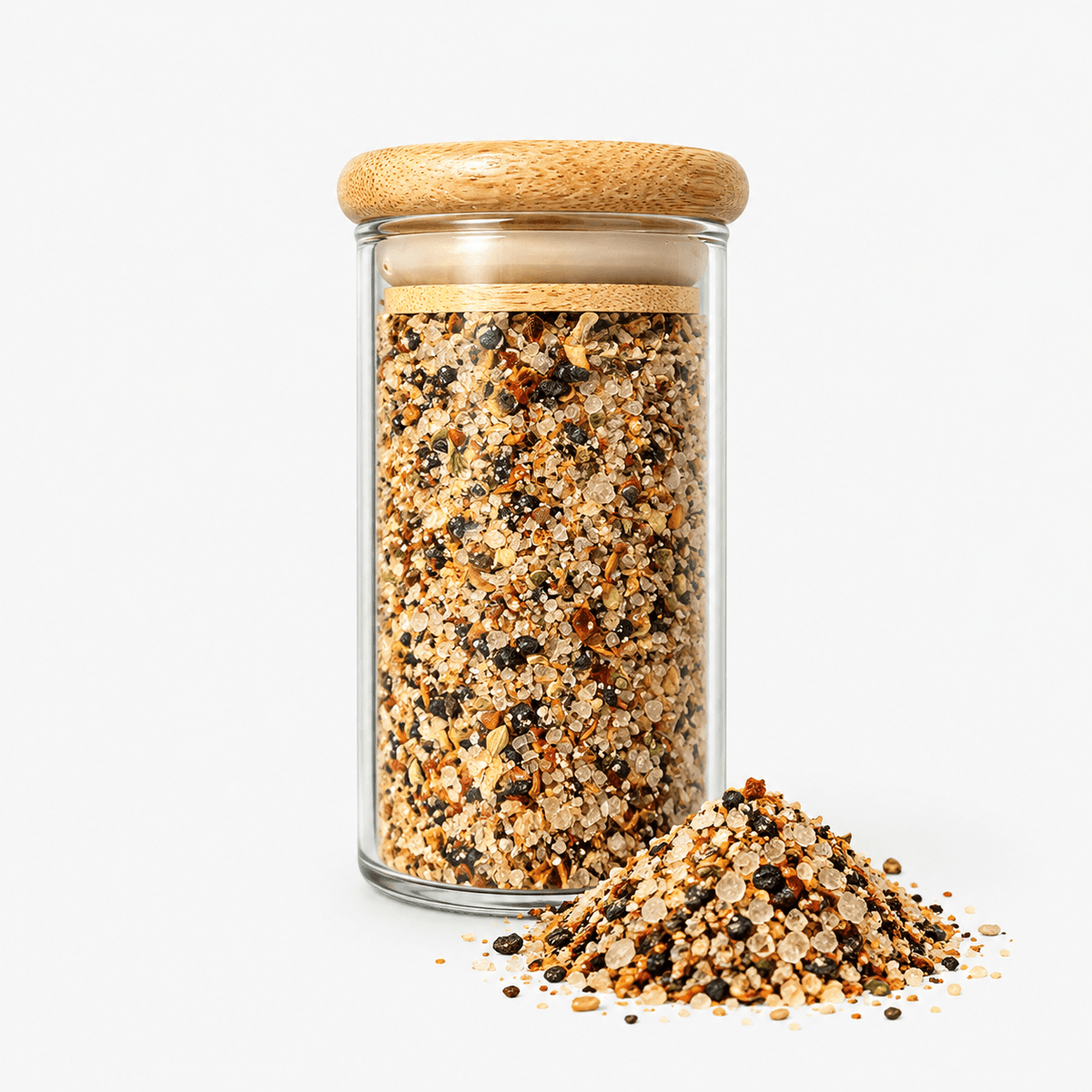 Fleur de Sel Texas Smokey Chipotle Blend – Smoked Chipotle Sea Salt in a glass jar with a wooden lid, showcasing its texture.