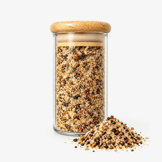 Fleur de Sel Texas Smokey Chipotle Blend – Smoked Chipotle Sea Salt in a glass jar with a wooden lid, showcasing its texture.