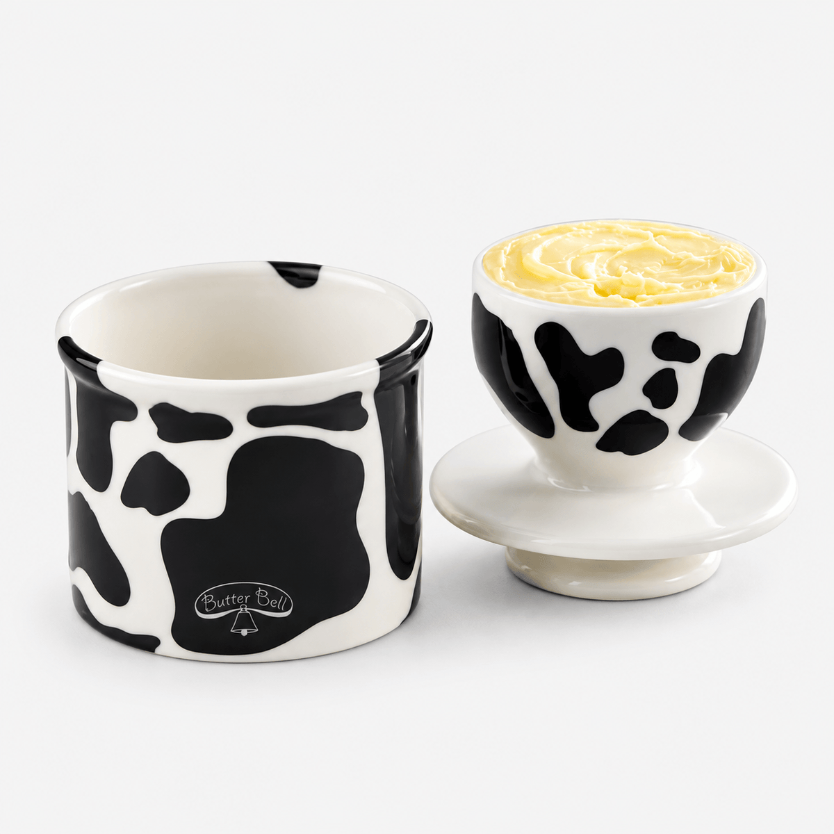 Butter Bell Crock – Cow Print Butter Keeper with elegant design for butter storage and farmhouse decor.