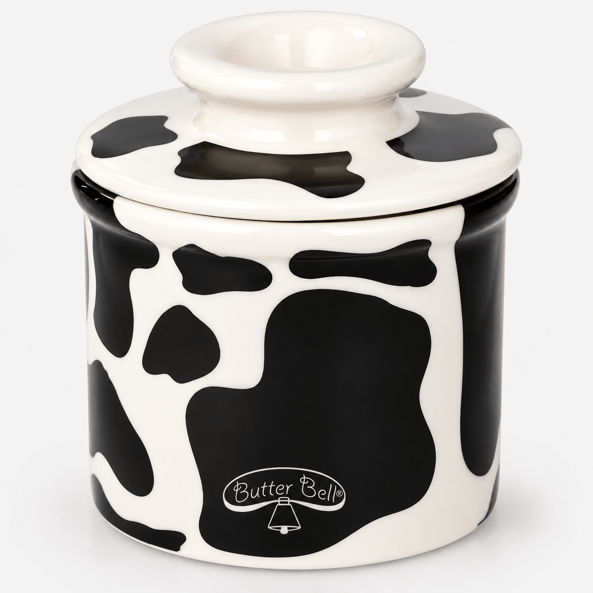 Butter Bell Crock – Cow Print Butter Keeper on a white background, showcasing its charming cow print design.
