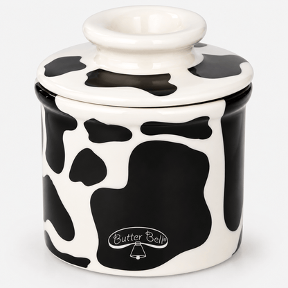 Butter Bell Crock – Cow Print Butter Keeper on a white background, showcasing its charming cow print design.