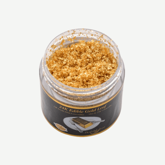 Jar of 24K edible gold leaf crumbs, perfect for adding luxury to food and beverages.