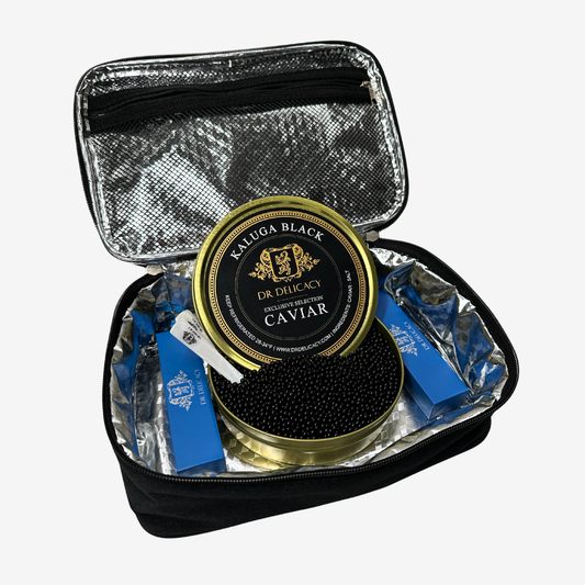 Caviar Holiday Tin Set featuring Kaluga Black caviar and serving spoons in an insulated bag.