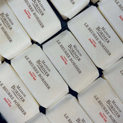 Le Beurre Bordier Mini Salted Butter "Demi-Sel" packaged in traditional paper wrappers.