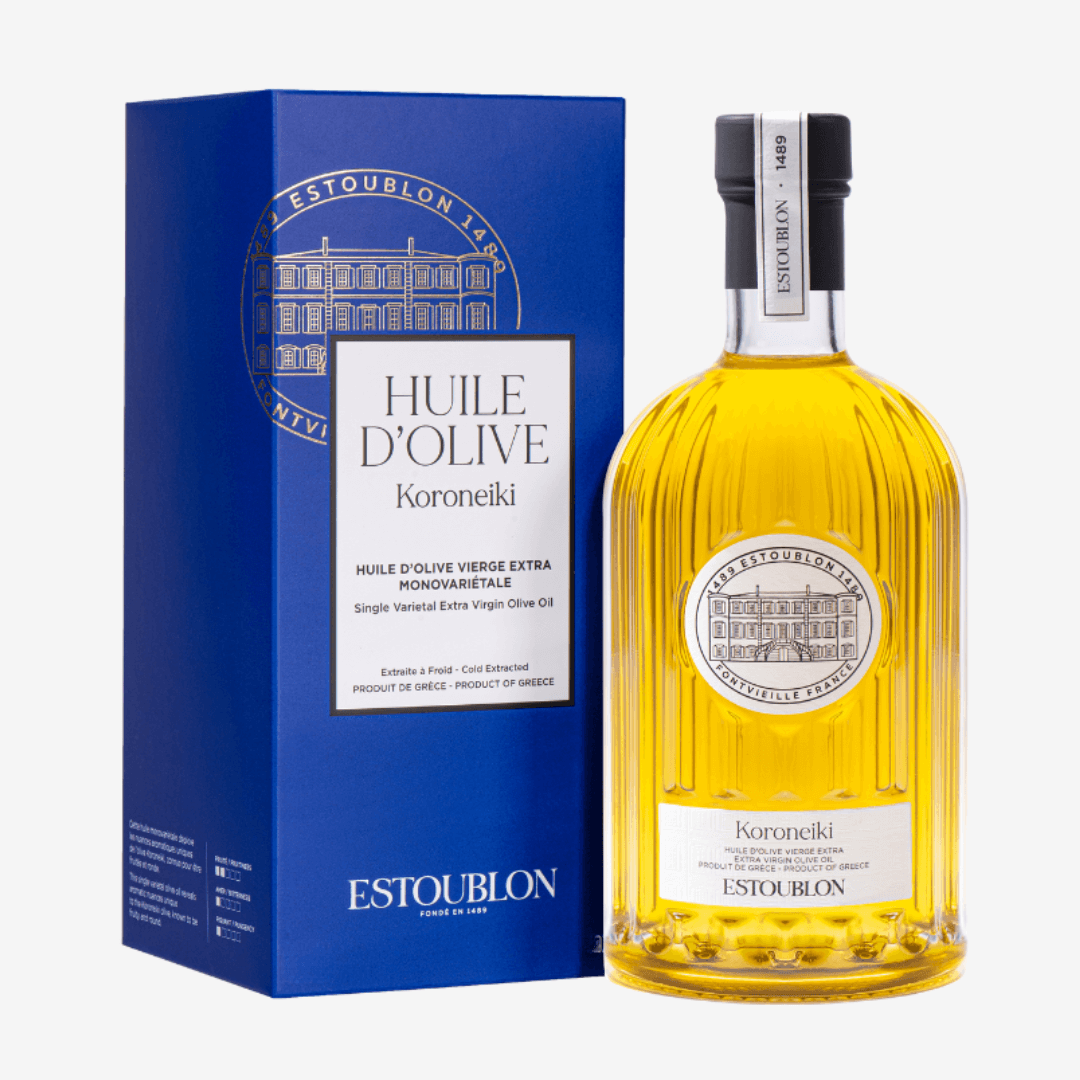 Koroneiki Olive Oil bottle with blue packaging and logo on white background, showcasing premium quality olive oil.