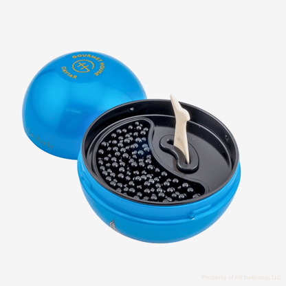 La Perle Caviar Gift Set featuring Kaluga Hybrid caviar and mother-of-pearl spoon in a stylish blue container.