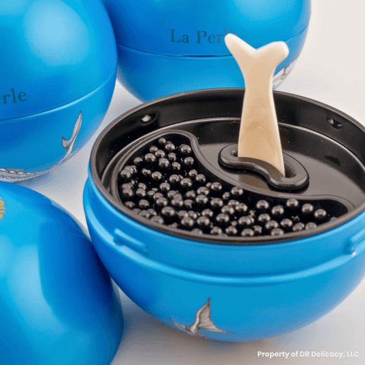 La Perle Caviar Gift Set with caviar compartment and mini mother-of-pearl spoon for elegant serving.