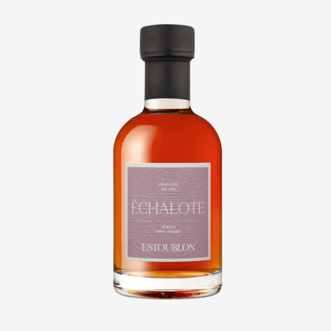 Shallot Wine Vinegar bottle with a brown liquid, showcasing its elegant design and label.