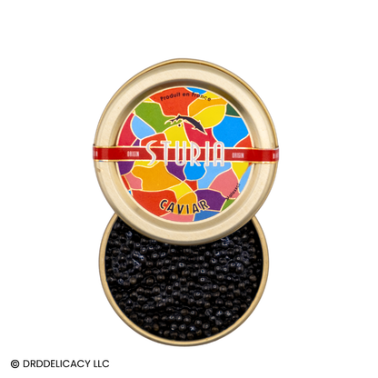 Sturia Siberian Origin Caviar in a colorful tin showcasing the premium product from France with jet black pearls.