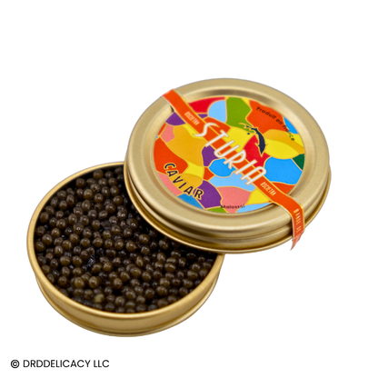 Sturia Osetra Classic Caviar in a decorative tin, showcasing medium dark amber pearls.