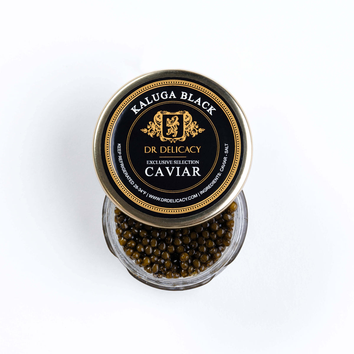 Kaluga Black Caviar in a glass jar with a gold lid labeled DR Delicacy, showcasing large, firm pearls.