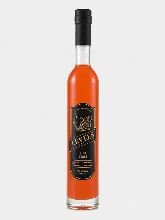 Levels of Grandeur Pink Guava Syrup in a glass bottle, featuring a vibrant orange color.