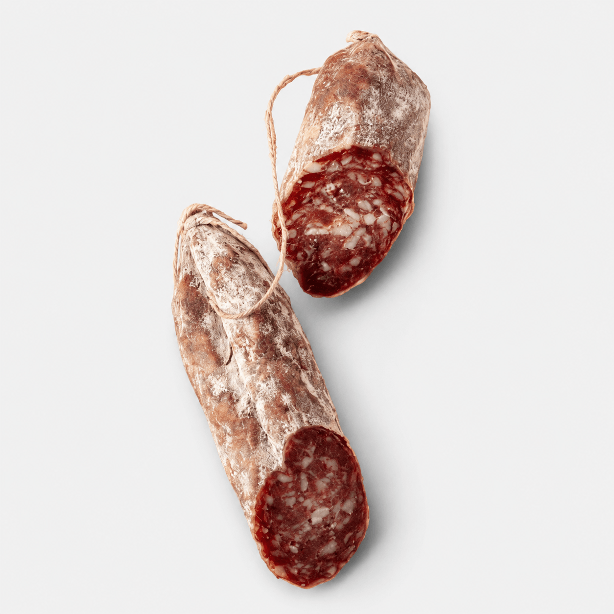 Dufour Saucisson Sec - French Style Salami showing sliced and whole pieces of dry-cured sausage.