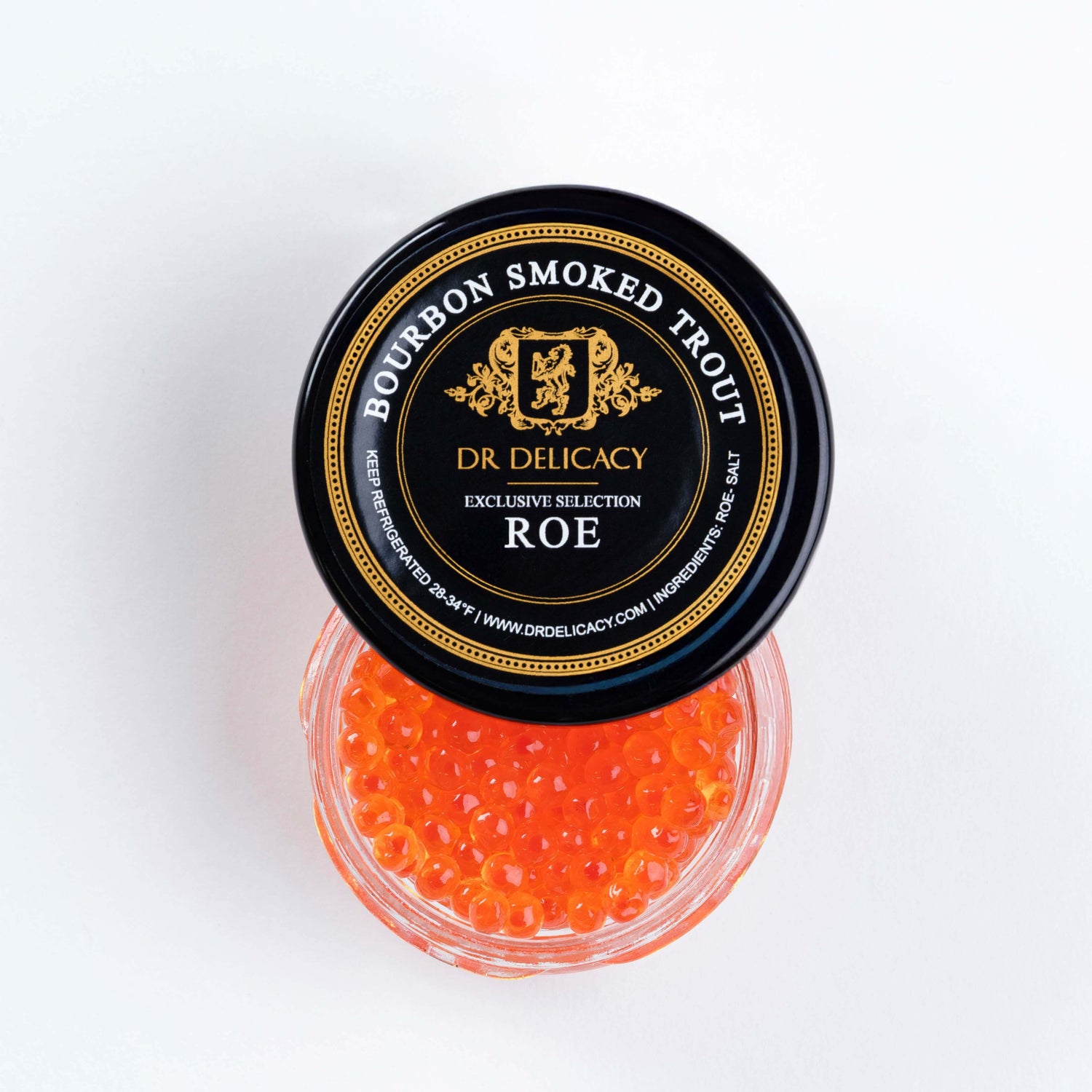 Bourbon Smoked Trout Roe in a jar, featuring vibrant orange pearls, perfect for gourmet appetizers and delicacies.
